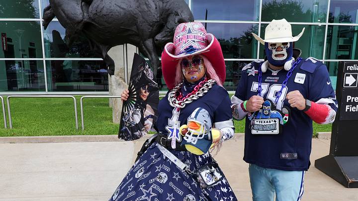 Dallas Cowboys fans pose for a photo before the game against the Houston Texans at Reliant Stadium.