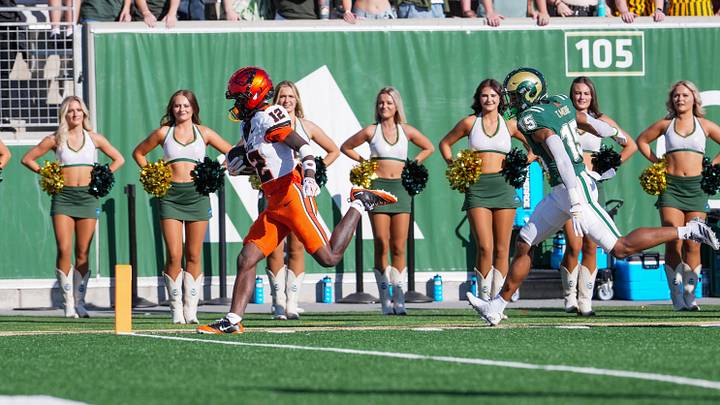 Oct 3, 2026; Fort Collins, Colorado, USA;  Oregon State Beavers wide receiver Jesse Legree (12) scores on a reception past Colorado State Rams safety Tre'Shawn Moore (15) at Sonny Lubick Field at Canvas Stadium.  Mandatory Credit: Andrew Rydland-Imagn Images