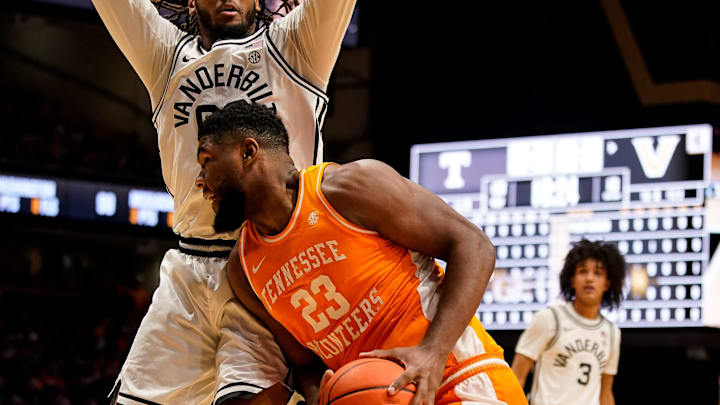 Tennessee forward Jaylen Carey (23) battles Vanderbilt forward Devin McGlockton (99) during the first half at Memorial Gym in Nashville, Tenn., Saturday, Feb. 21, 2026.