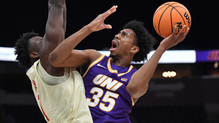 Mar 8, 2026; St. Louis, MO, USA;  Northern Iowa Panthers guard Leon Bond III (35) shoots the ball over UIC Flames forward Abdul Momoh (7) during the second half at Enterprise Center.