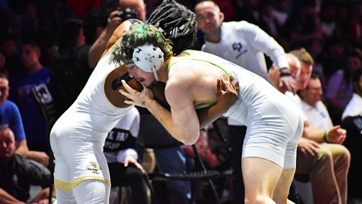 Allen's Jair Jackson-Bey, left, and The Woodlands College Park's Logan Milsaps tangle in the 144-pound 6A finals.