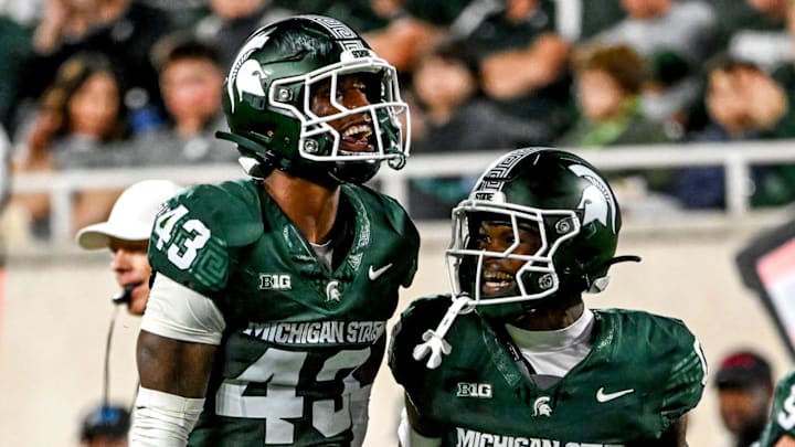 Michigan State's Malik Spencer, left, celebrates a stop with Charles Brantley during the first quarter in the game against Ohio State on Saturday, Sept. 28, 2024, at Spartan Stadium in East Lansing.