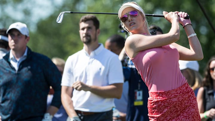 Paige Spiranac tees off for the 15th hole during the AREA 313 Celebrity Challenge of the Rocket Mortgage Classic at Detroit Golf Club in Detroit.