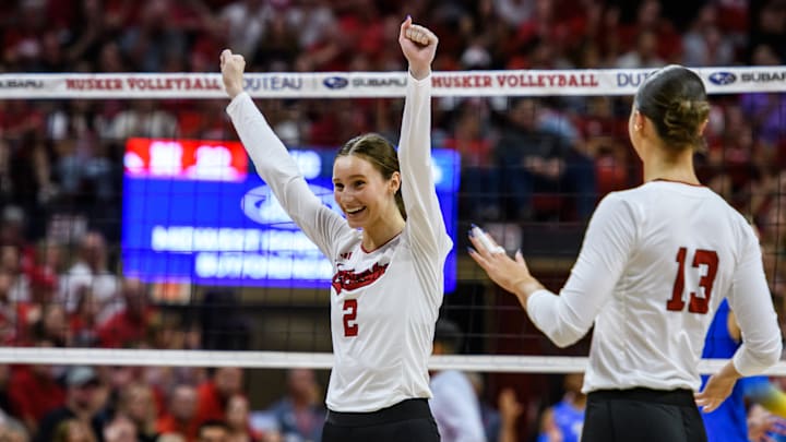 Bergen Reilly celebrates a UCLA service error. 