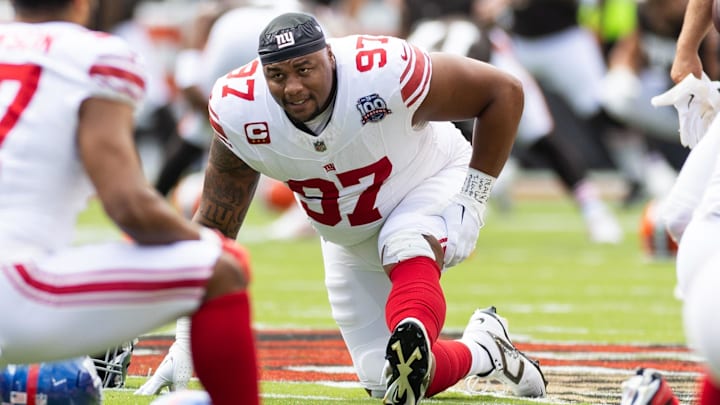 Sep 22, 2024; Cleveland, Ohio, USA; New York Giants defensive tackle Dexter Lawrence II (97) stretches during warm ups before the game against the Cleveland Browns at Huntington Bank Field. Mandatory Credit: Scott Galvin-Imagn Images