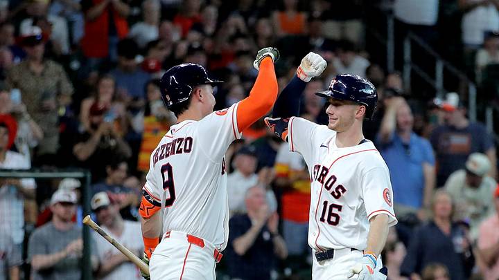 Houston Astros right fielder Zach Cole (16) is congratulated by left fielder Zach Dezenzo (9) after hitting a home run against the Texas Rangers. Houston Astros right fielder Zach Cole (16) is congratulated by left fielder Zach Dezenzo (9) after hitting a home run against the Texas Rangers.