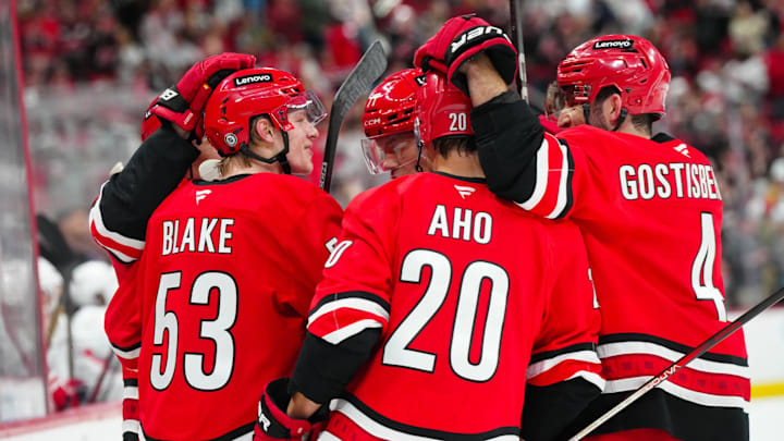 Apr 2, 2025; Raleigh, North Carolina, USA;  Carolina Hurricanes right wing Jackson Blake (53) celebrates a goal with center Seth Jarvis (24), left wing Taylor Hall (71), defenseman Shayne Gostisbehere (4) and center Sebastian Aho (20) against the Washington Capitals during the first period at Lenovo Center. Mandatory Credit: James Guillory-Imagn Images