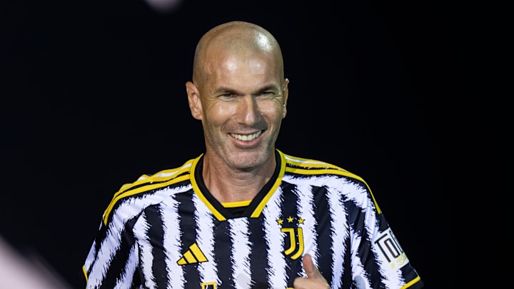 Zinedine Zidane smiles as he enters the pitch during the'...
