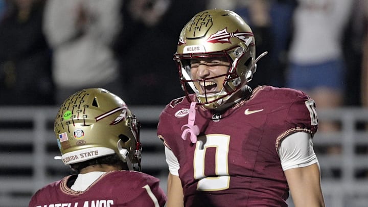 Nov 1, 2025; Tallahassee, Florida, USA; Florida State Seminoles quarterback Tommy Castellanos (1) celebrates a touchdown with wide receiver Duce Robinson (0) during the second half against the Wake Forest Demon Deacons at Doak S. Campbell Stadium. Mandatory Credit: Melina Myers-Imagn Images