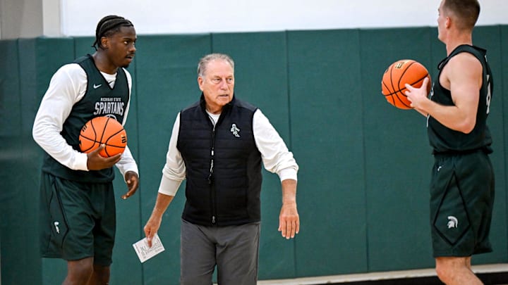 Michigan State's coach Tom Izzo, left, talks with Coen Carr, left, and Denham Wojcik during the first day of basketball practice on Monday, Sept. 22, 2025, at the Breslin Center in East Lansing.