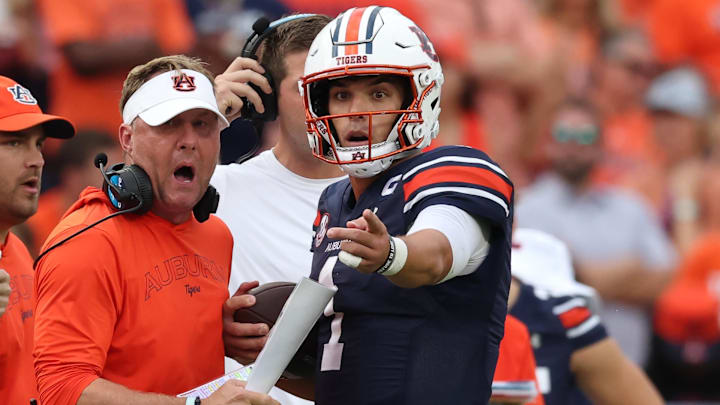 Sep 28, 2024; Auburn, Alabama, USA;  Auburn Tigers head coach Hugh Freeze talks with quarterback Payton Thorne (1) 