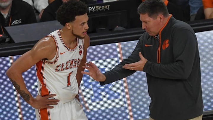 Dec 3, 2024; Clemson, South Carolina, USA; Clemson guard Chase Hunter (1) listens to Clemson Head Coach Brad Brownell playing Kentucky during the first half at Littlejohn Coliseum. Mandatory Credit: Ken Ruinard-Imagn Images