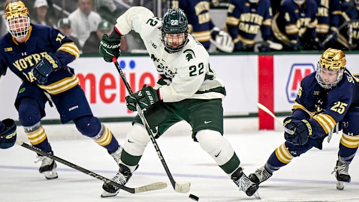 Michigan State's Isaac Howard moves the puck against Notre Dame during the second period in the Big Ten tournament on Saturday, March 15, 2025, at Muni Arena in East Lansing.