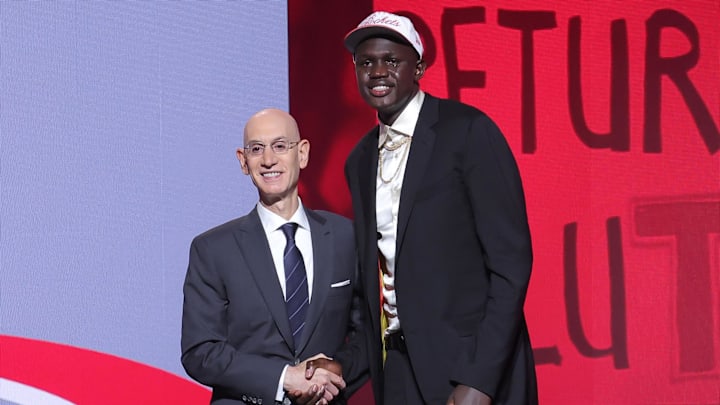 Khaman Maluach stands with NBA commissioner Adam Silver after being selected as the tenth pick by the Houston Rockets in the first round of the 2025 NBA Draft at Barclays Center. Khaman Maluach stands with NBA commissioner Adam Silver after being selected as the tenth pick by the Houston Rockets in the first round of the 2025 NBA Draft at Barclays Center.