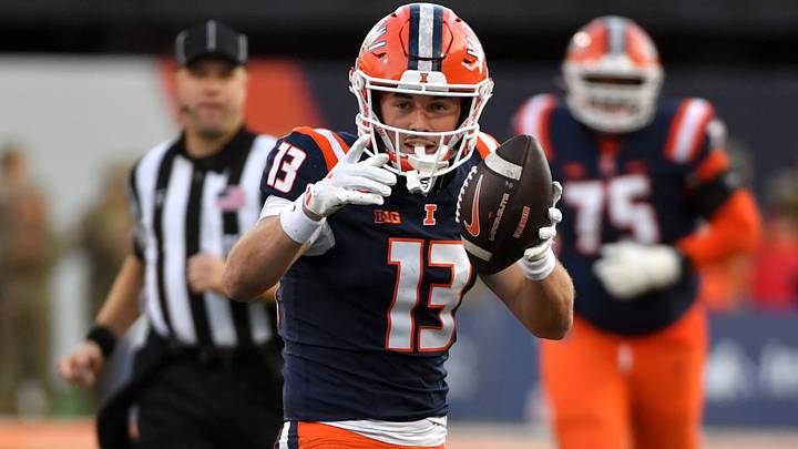 Nov 15, 2025; Champaign, Illinois, USA; Illinois Fighting Illini wide receiver Hudson Clement (13) reacts after a catch and run during the first half against the Maryland Terrapins at Memorial Stadium. Mandatory Credit: Ron Johnson-Imagn Images