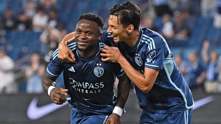 Jul 10, 2024; Kansas City, Kansas, USA;  Sporting Kansas City forward Willy Agada (23) celebrates after scoring a goal with teammate Daniel Salloi (10) in the second half against FC Dallas at Children's Mercy Park. Mandatory Credit: Peter Aiken-USA TODAY Sports