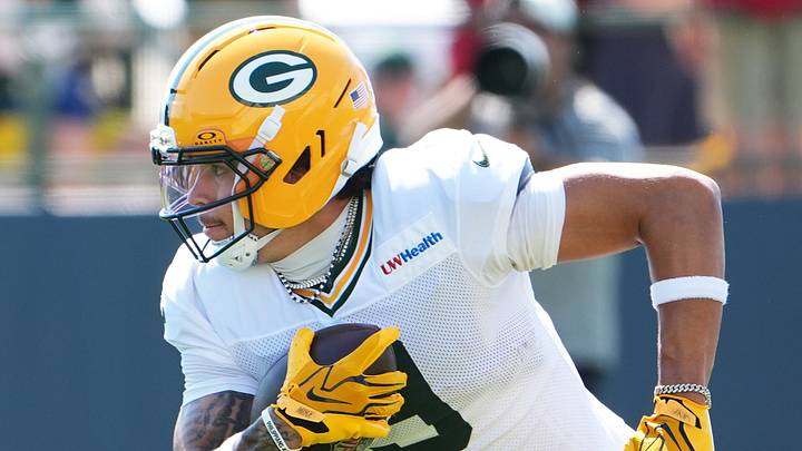 Green Bay Packers wide receiver Christian Watson runs after the catch at training camp. Green Bay Packers wide receiver Christian Watson runs after the catch at training camp.