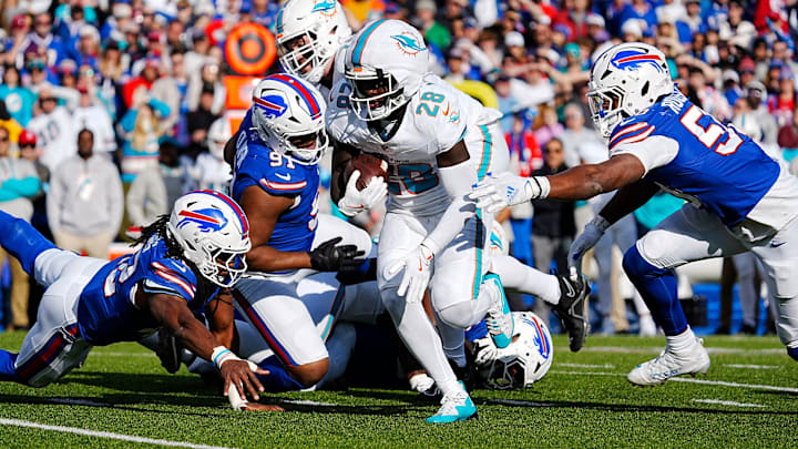 Bills Dorian Williams, Ed Oliver and Greg Rousseau see Miami's De'Von Achane running with the ball and turn to try and tackle him during first half action at Highmark Stadium on Nov. 3, 2024.