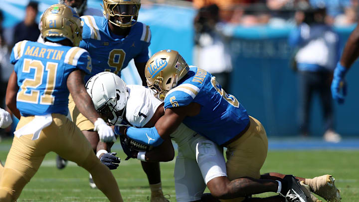 Oct 4, 2025; Pasadena, California, USA; Penn State Nittany Lions wide receiver Kyron Hudson (1) is tackled by UCLA Bruins linebacker Jonjon Vaughns (6) during the first half at Rose Bowl. Mandatory Credit: Kiyoshi Mio-Imagn Images Oct 4, 2025; Pasadena, California, USA; Penn State Nittany Lions wide receiver Kyron Hudson (1) is tackled by UCLA Bruins linebacker Jonjon Vaughns (6) during the first half at Rose Bowl. Mandatory Credit: Kiyoshi Mio-Imagn Images