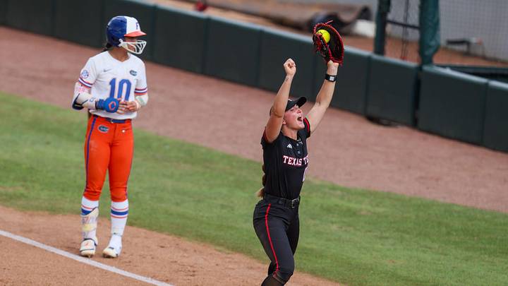 Texas Tech infielder Jackie Lis (00) celebrates making the winning out on first base during game 3 of the super regional of the NCAA Division 1 softball championship at Katie Seashole Pressly Stadium in Gainesville, FL on Sunday, May 24, 2026. [Alan Youngblood/Gainesville Sun]
