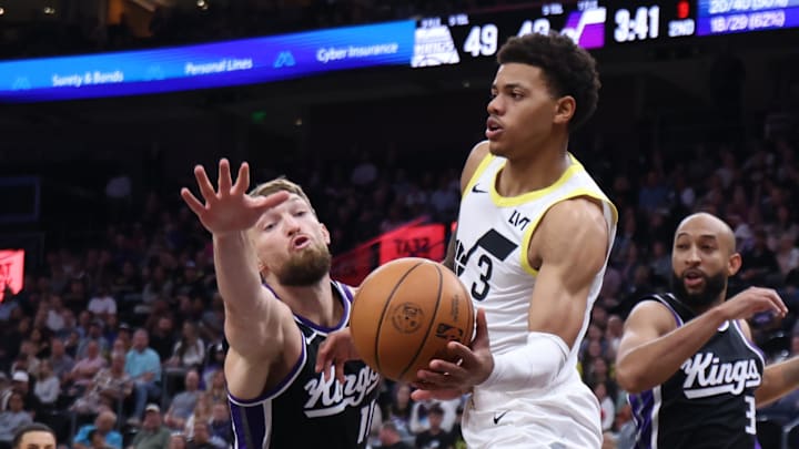 Oct 15, 2024; Salt Lake City, Utah, USA; Utah Jazz guard Keyonte George (3) passes the ball beyond the reach of Sacramento Kings forward Domantas Sabonis (11) during the second quarter at Delta Center. Mandatory Credit: Rob Gray-Imagn Images