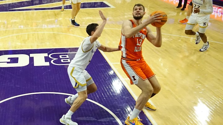 Jan 14, 2026; Evanston, Illinois, USA; Northwestern Wildcats guard Jake West (3) defends Illinois Fighting Illini center Tomislav Ivisic (13) during the second half at Welsh-Ryan Arena. Mandatory Credit: David Banks-Imagn Images