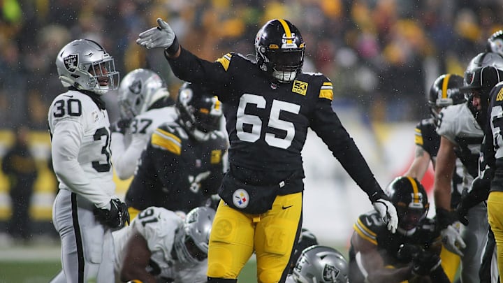 Pittsburgh Steelers Dan Moore Jr. (65) signals for a first down during the first half against the Las Vegas Raiders at Acrisure Stadium in Pittsburgh, PA on December 24, 2022.

Pittsburgh Steelers Vs Las Vegas Raiders Week 16