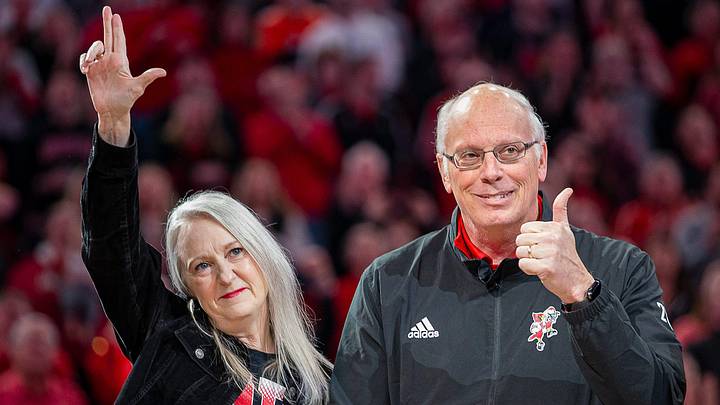 Former Louisville Sports Information Director Kenny Klein gave a thumbs-up to the crowd with his wife by his side as the Louisville Cardinals 2013 National Championship squad was honoroed during halftime of Louisville's game against Clemson at the KFC Yum Center on Saturday evening. Feb. 18, 2023