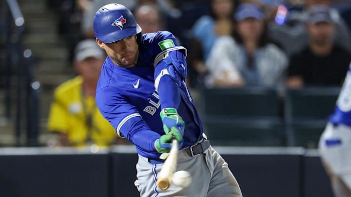 Toronto Blue Jays outfielder George Springer (21) hits an rbi single against the Tampa Bay Rays in the eleventh inning at George M. Steinbrenner Field. 