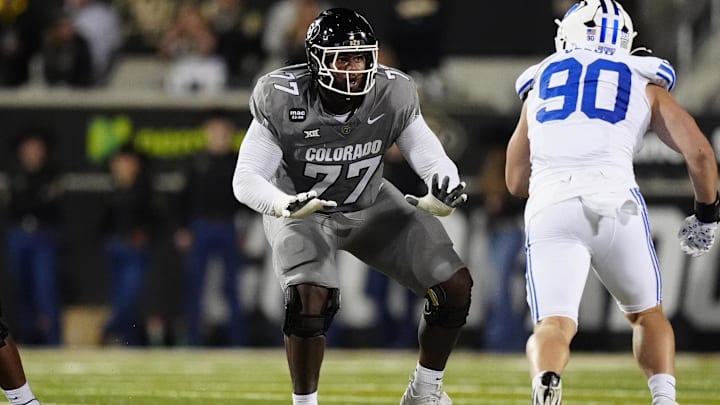 Sep 27, 2025; Boulder, Colorado, USA; Colorado Buffaloes offensive tackle Jordan Seaton (77) pass protects on Brigham Young Cougars defensive end Hunter Clegg (90) in the second quarter at Folsom Field. Mandatory Credit: Ron Chenoy-Imagn Images Sep 27, 2025; Boulder, Colorado, USA; Colorado Buffaloes offensive tackle Jordan Seaton (77) pass protects on Brigham Young Cougars defensive end Hunter Clegg (90) in the second quarter at Folsom Field. Mandatory Credit: Ron Chenoy-Imagn Images