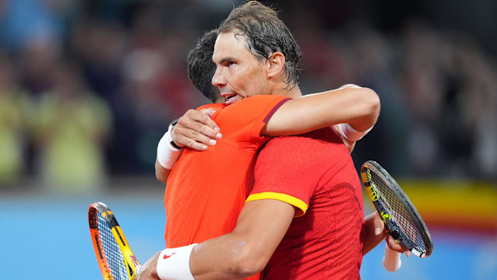Rafael Nadal (ESP) and Carlos Alcaraz (ESP) celebrate defeating Maximo Gonzalez (ARG) and Andres Molteni (ARG) in a men's tennis doubles match during the Paris 2024 Olympic Summer Games at Stade Roland Garros. Mandatory Credit: Amber Searls-Imagn Images