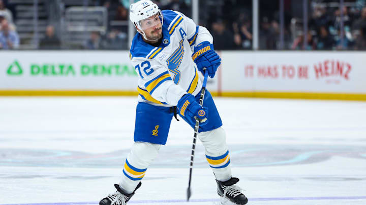 Mar 4, 2026; Seattle, Washington, USA; St. Louis Blues defenseman Justin Faulk (72) attempts a shot on goal in the first period against the Seattle Kraken at Climate Pledge Arena. Mandatory Credit: Kevin Ng-Imagn Images