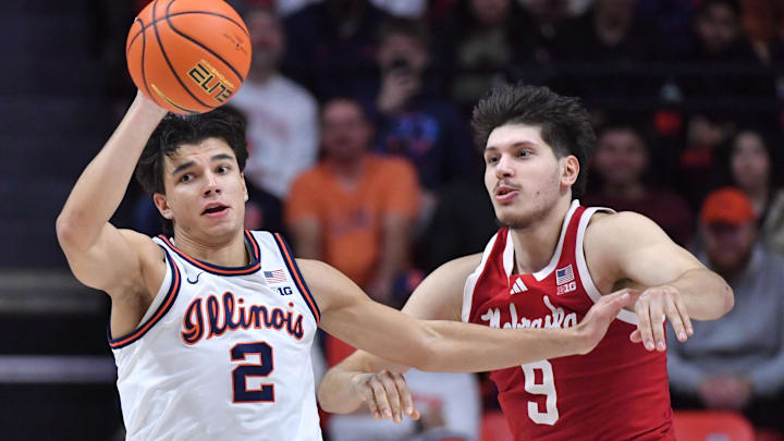 Dec 13, 2025; Champaign, Illinois, USA;  Illinois Fighting Illini guard Andrej Stojakovic (2) passes the ball as he is guarded by Nebraska Cornhuskers forward Berke Buyuktuncel (9) during the second half at State Farm Center. Mandatory Credit: Ron Johnson-Imagn Images