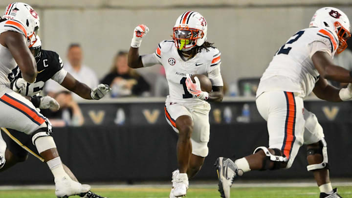 Nov 8, 2025; Nashville, Tennessee, USA;  Auburn Tigers wide receiver Eric Singleton Jr. (1) runs with the ball after a made catch against the Vanderbilt Commodores during the first half at FirstBank Stadium. Mandatory Credit: Steve Roberts-Imagn Images