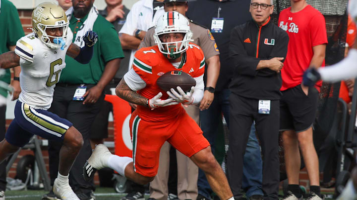 Nov 9, 2024; Atlanta, Georgia, USA; Miami Hurricanes wide receiver Xavier Restrepo (7) catches a pass for a touchdown against the Georgia Tech Yellow Jackets in the fourth quarter at Bobby Dodd Stadium at Hyundai Field. Mandatory Credit: Brett Davis-Imagn Images