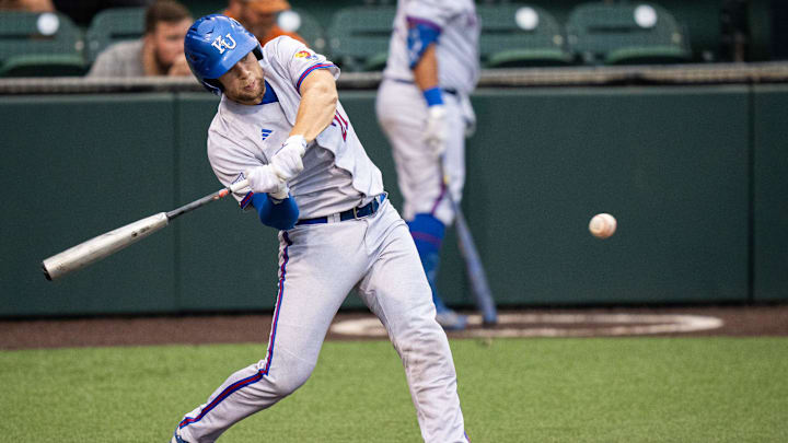 Kansas Jayhawks catcher Jake English (21) bats in the third inning of the Texas Longhorns' game against the Jayhawks, Thursday, May 16, 2024 at UFCU Disch-Falk Field in Austin.