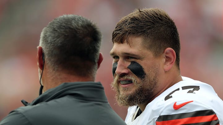 Cleveland Browns guard Wyatt Teller (77) chats with senior consultant Mike Vrabel on the sideline during the first half of an NFL preseason football game at Cleveland Browns Stadium, Saturday, Aug. 10, 2024, in Cleveland, Ohio.