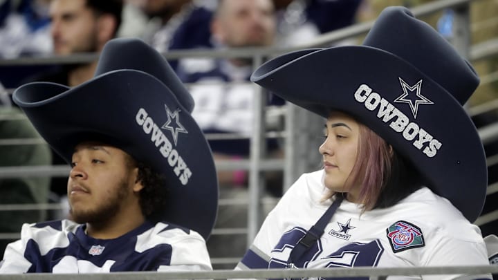 Dallas Cowboy fans react during the fourth quarter in a 2024 NFC wild card game at AT&T Stadium.