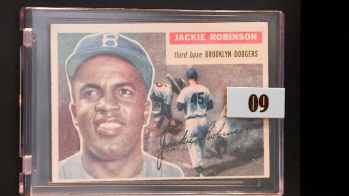 A signed Brooklyn Dodgers Jackie Robinson baseball card is part of the Elliott Museum's large collection of signed memorabilia including bats and balls from the Major Leagues, the Negro Leagues and the All-American Girls Professional Baseball League. Some of the notable signatures include Shoeless Joe Jackson, Hank Aaron, Jackie Robinson, Nolan Ryan, Ted Williams, Derek Jeter, Bob Feller, Ralph Kiner and Babe Ruth.
