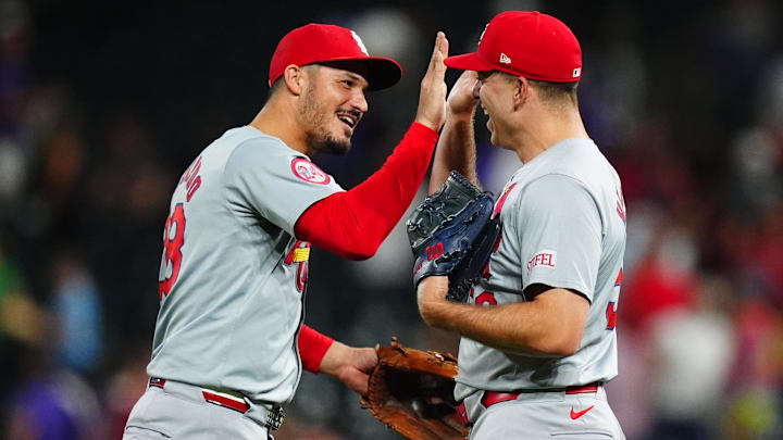 Sep 25, 2024; Denver, Colorado, USA; St. Louis Cardinals third base Nolan Arenado (28) and relief pitcher Ryan Helsley (56) celebrate defeating the Colorado Rockies at Coors Field. Mandatory Credit: Ron Chenoy-Imagn Images