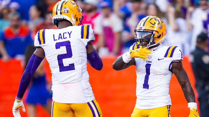 LSU Tigers wide receiver Kyren Lacy (2) celebrates teammates LSU Tigers wide receiver Aaron Anderson (1) touchdown during the first half at Ben Hill Griffin Stadium in Gainesville, FL on Saturday, November 16, 2024. [Doug Engle/Gainesville Sun]