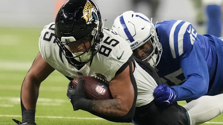 Jan 5, 2025; Indianapolis, Indiana, USA; Indianapolis Colts linebacker E.J. Speed (45) tackles Jacksonville Jaguars tight end Brenton Strange (85) during a game against the Jacksonville Jaguars at Lucas Oil Stadium. Mandatory Credit: Christine Tannous/USA TODAY Network via Imagn Images
