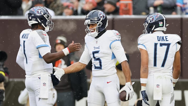 Dec 7, 2025; Cleveland, Ohio, USA; Tennessee Titans wide receiver Elic Ayomanor (5) celebrates with quarterback Cam Ward (1) after catching a touchdown pass against the Cleveland Browns during the first quarter at Huntington Bank Field. at Huntington Bank Field. Mandatory Credit: Scott Galvin-Imagn Images Dec 7, 2025; Cleveland, Ohio, USA; Tennessee Titans wide receiver Elic Ayomanor (5) celebrates with quarterback Cam Ward (1) after catching a touchdown pass against the Cleveland Browns during the first quarter at Huntington Bank Field. at Huntington Bank Field. Mandatory Credit: Scott Galvin-Imagn Images