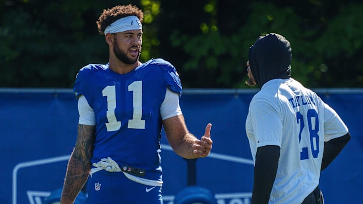 Indianapolis Colts wide receiver Michael Pittman Jr. (11) speaks with Indianapolis Colts running