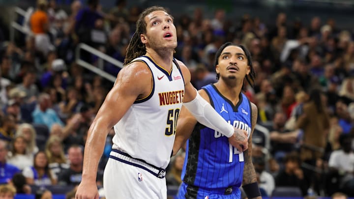 Denver Nuggets forward Aaron Gordon (50) and Orlando Magic guard Gary Harris (14) look for the rebound during the second half at Amway Center. Denver Nuggets forward Aaron Gordon (50) and Orlando Magic guard Gary Harris (14) look for the rebound during the second half at Amway Center.