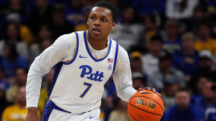 Mar 9, 2024; Pittsburgh, Pennsylvania, USA;  Pittsburgh Panthers guard Carlton Carrington (7) brings the ball up court against the North Carolina State Wolfpack during the first half at the Petersen Events Center. Mandatory Credit: Charles LeClaire-USA TODAY Sports