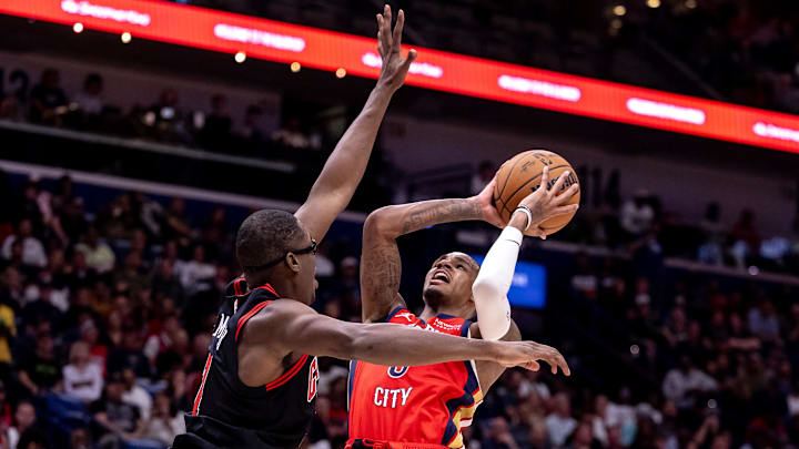 Oct 23, 2024; New Orleans, Louisiana, USA;  New Orleans Pelicans guard Dejounte Murray (5) shoots a jump shot against Chicago Bulls forward Jalen Smith (7) during the second half at Smoothie King Center. 