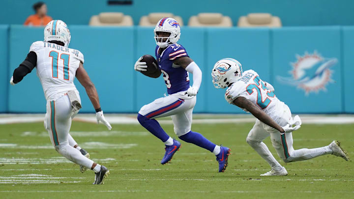 Nov 9, 2025; Miami Gardens, Florida, USA; Buffalo Bills wide receiver Elijah Moore (18) runs against Miami Dolphins safety Dante Trader Jr. (11) and cornerback Jack Jones (23) during the second half at Hard Rock Stadium. Mandatory Credit: Jeff Romance-Imagn Images Nov 9, 2025; Miami Gardens, Florida, USA; Buffalo Bills wide receiver Elijah Moore (18) runs against Miami Dolphins safety Dante Trader Jr. (11) and cornerback Jack Jones (23) during the second half at Hard Rock Stadium. Mandatory Credit: Jeff Romance-Imagn Images