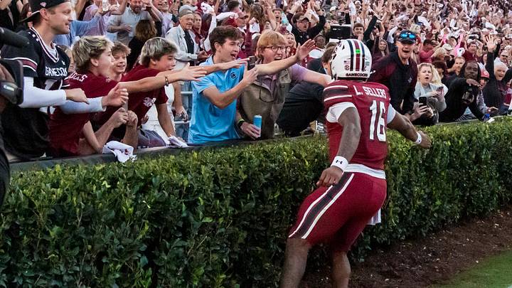 Oct 25, 2025; Columbia, South Carolina, USA; South Carolina Gamecocks quarterback Lanorris Sellers (16) celebrates with fans after scoring a rushing touchdown against the Alabama Crimson Tide in the fourth quarter at Williams-Brice Stadium. Mandatory Credit: Jeff Blake-Imagn Images
