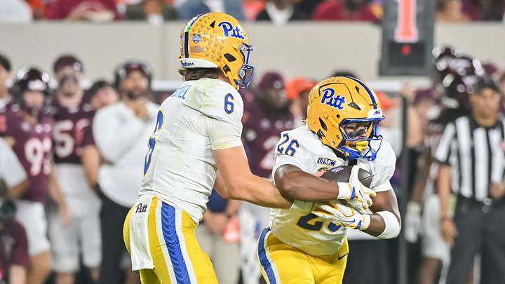 Oct 2, 2026; Blacksburg, Virginia, USA; Pittsburgh Panthers quarterback Mason Heintschel (6) hands the ball off to Pittsburgh Panthers running back Damon Ferguson Jr. (26) during the second quarter at Lane Stadium. Mandatory Credit: Brian Bishop-Imagn Images Oct 2, 2026; Blacksburg, Virginia, USA; Pittsburgh Panthers quarterback Mason Heintschel (6) hands the ball off to Pittsburgh Panthers running back Damon Ferguson Jr. (26) during the second quarter at Lane Stadium. Mandatory Credit: Brian Bishop-Imagn Images